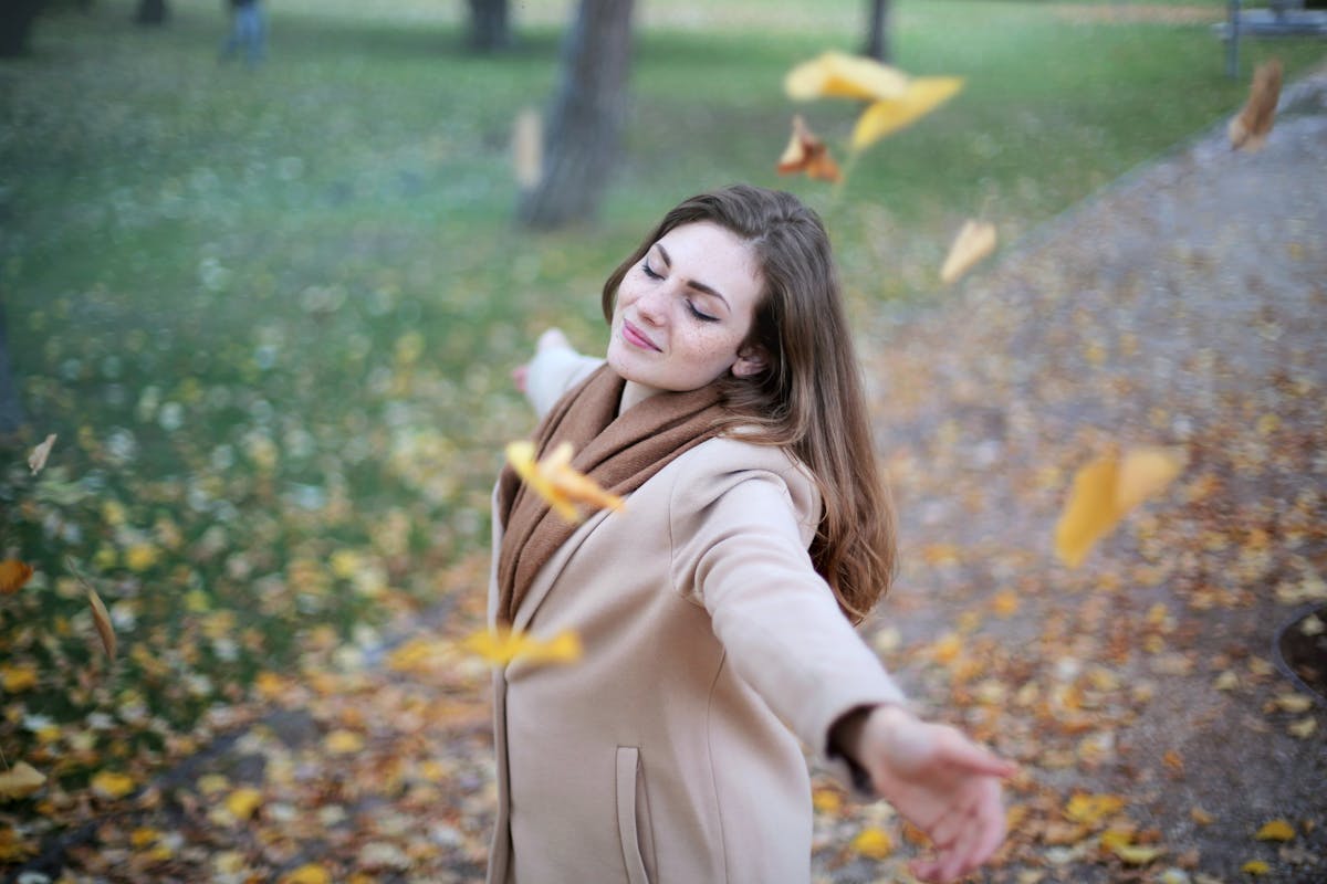 Woman Open Arms While Closed-eyes Smiling