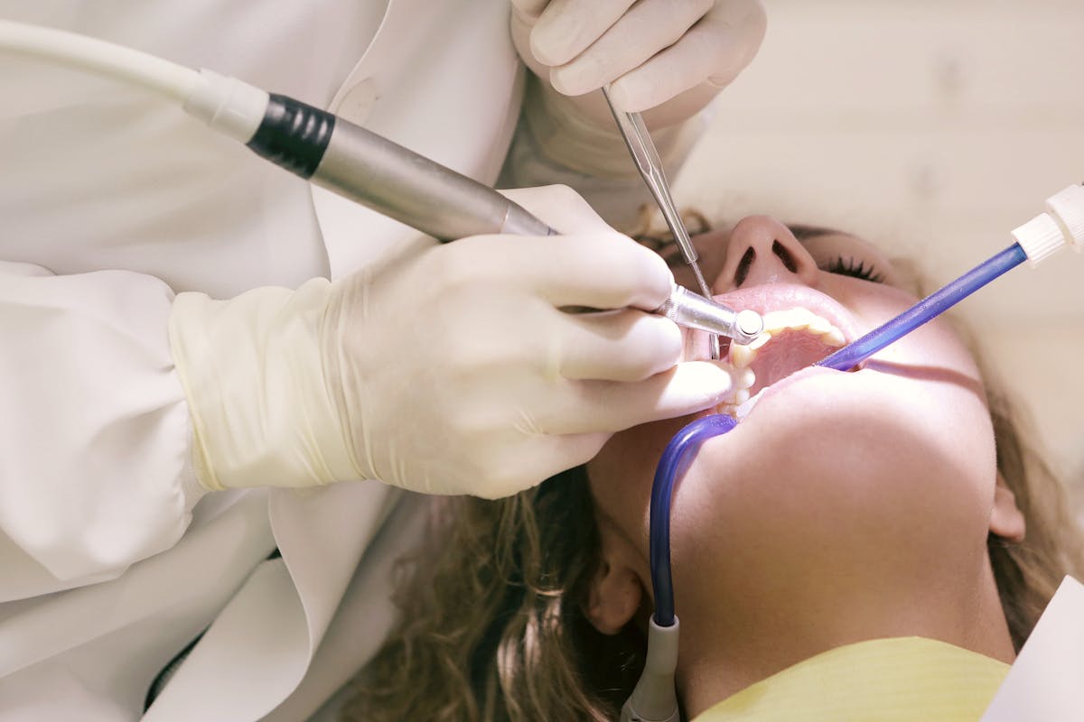 Dentist Working Working on Woman's Teeth