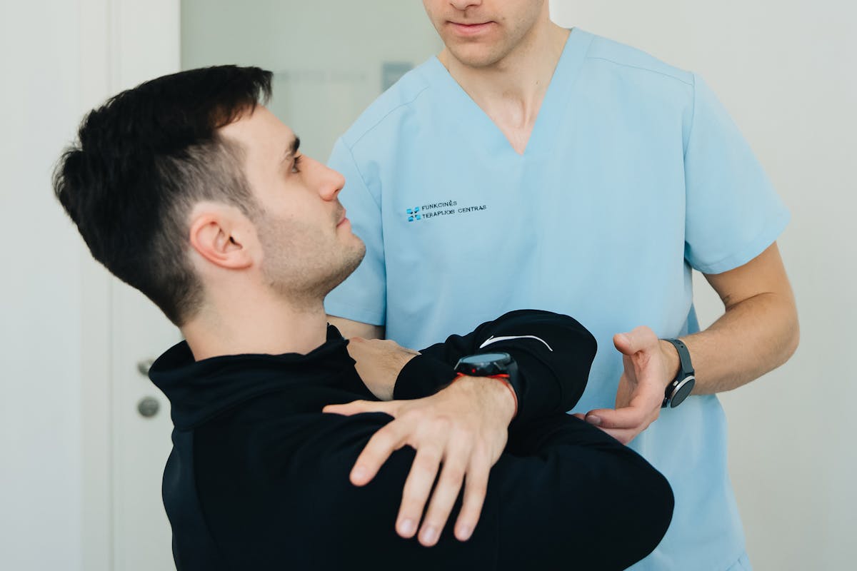 Man Exercising with Physiotherapist